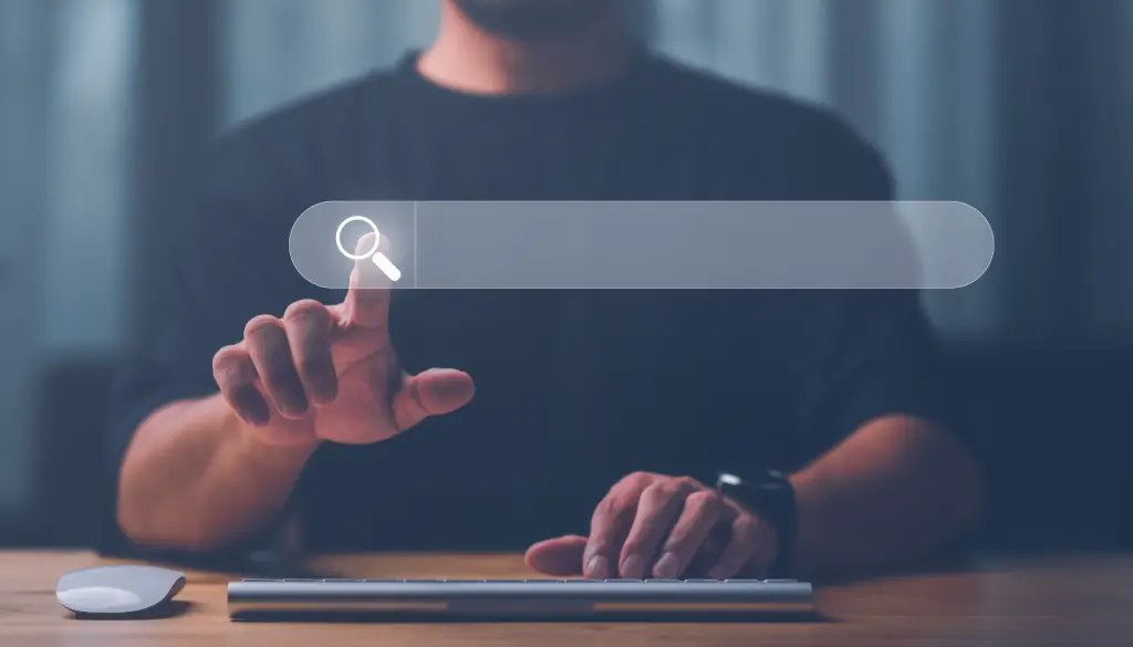 A hand reaching for a search box floating in front of a person.