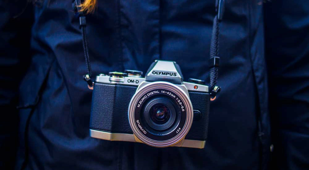 An Olympus camera on its strap.