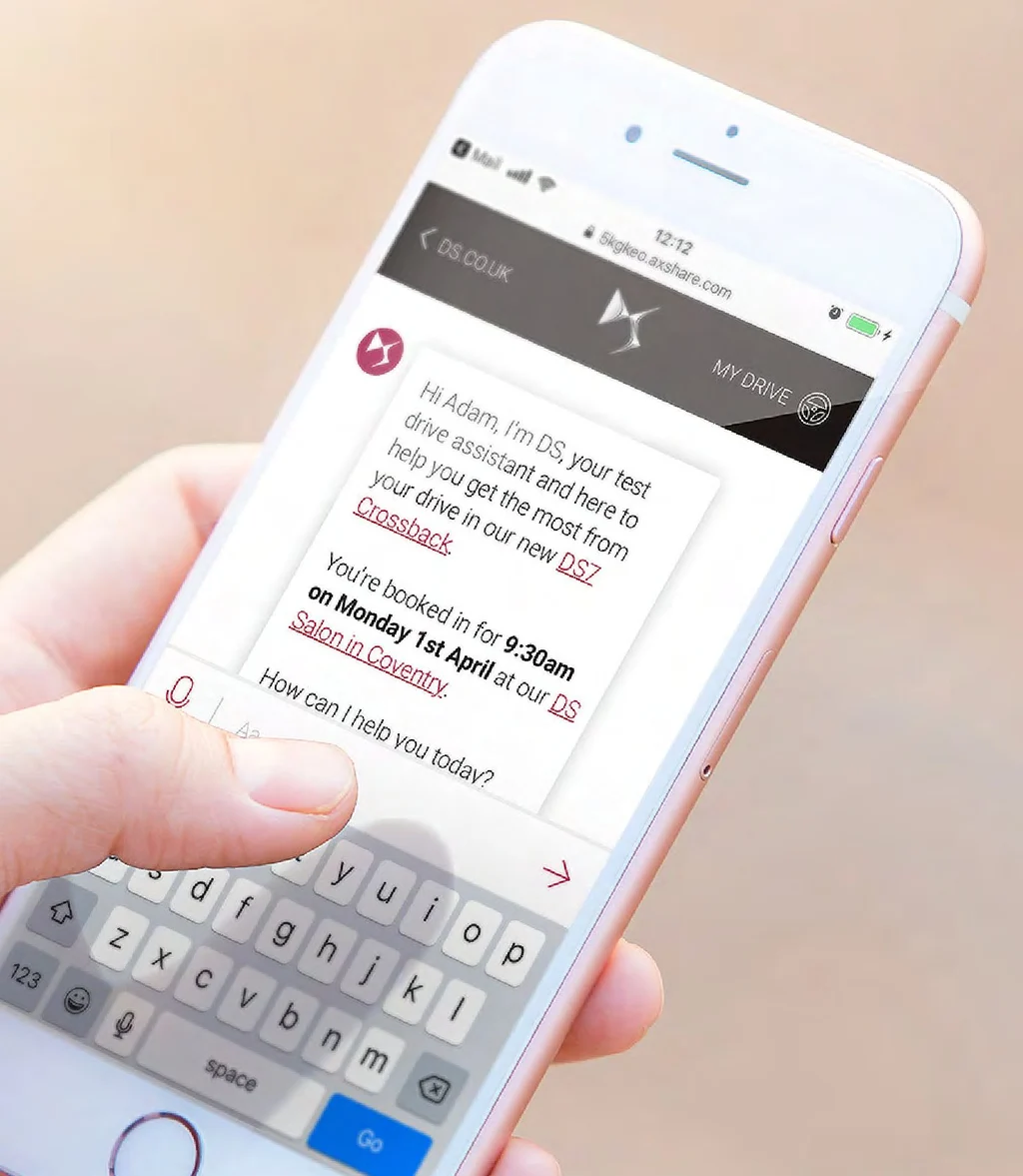 The DS chatbot on a phone, introducing itself as a test drive assistant and confirming a booking for 9:30am on Monday 1st April at the DS Salon in Coventry.